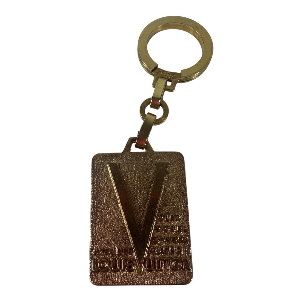 Louis Vuitton Volez Voguez Voyagez LV Gold Metal Engraved Keychain Bag Charm
